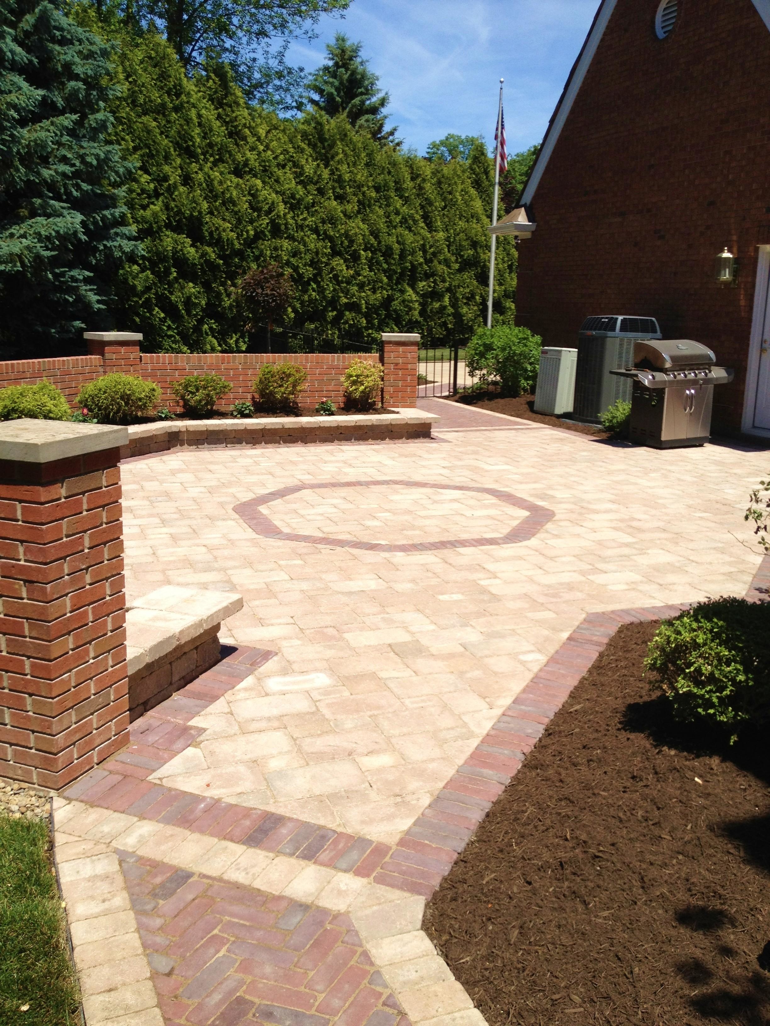 This is a Unilock patio and mason walls that we had installed in 2012 in Westlake Ohio. We used Brussels and Copthorn pavers alternating from the walks to the main patio. This is an example of some of the complex projects we work on.