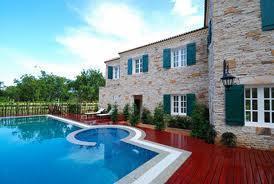 Marble tile and cherry wood floor pool deck