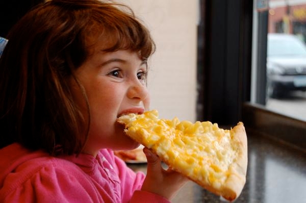 Looks like she likes her pizza!