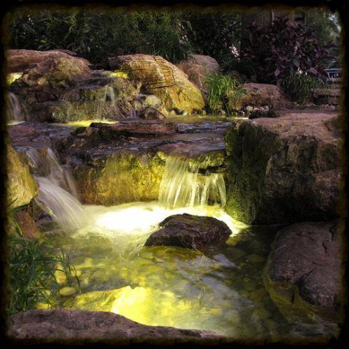 The addition of lights make a water feature come alive after sunset.