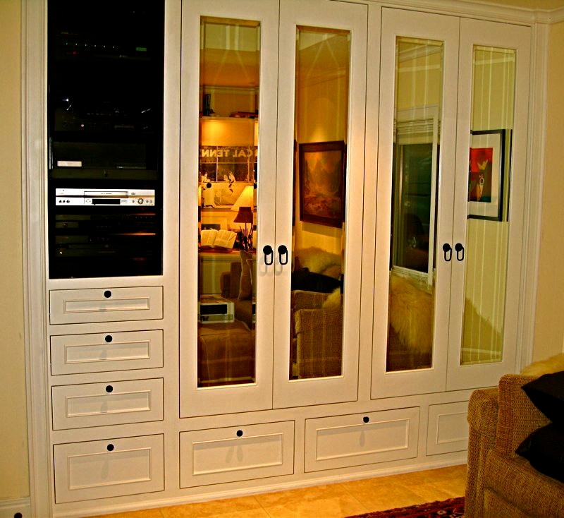His, built in custom closet features integrated hi fi system, beveled mirror doors, aromatic Cedar lining throughout, tie rack, interior lighting, jewelry drawer in interior Redwood drawer system and shoe rack.
