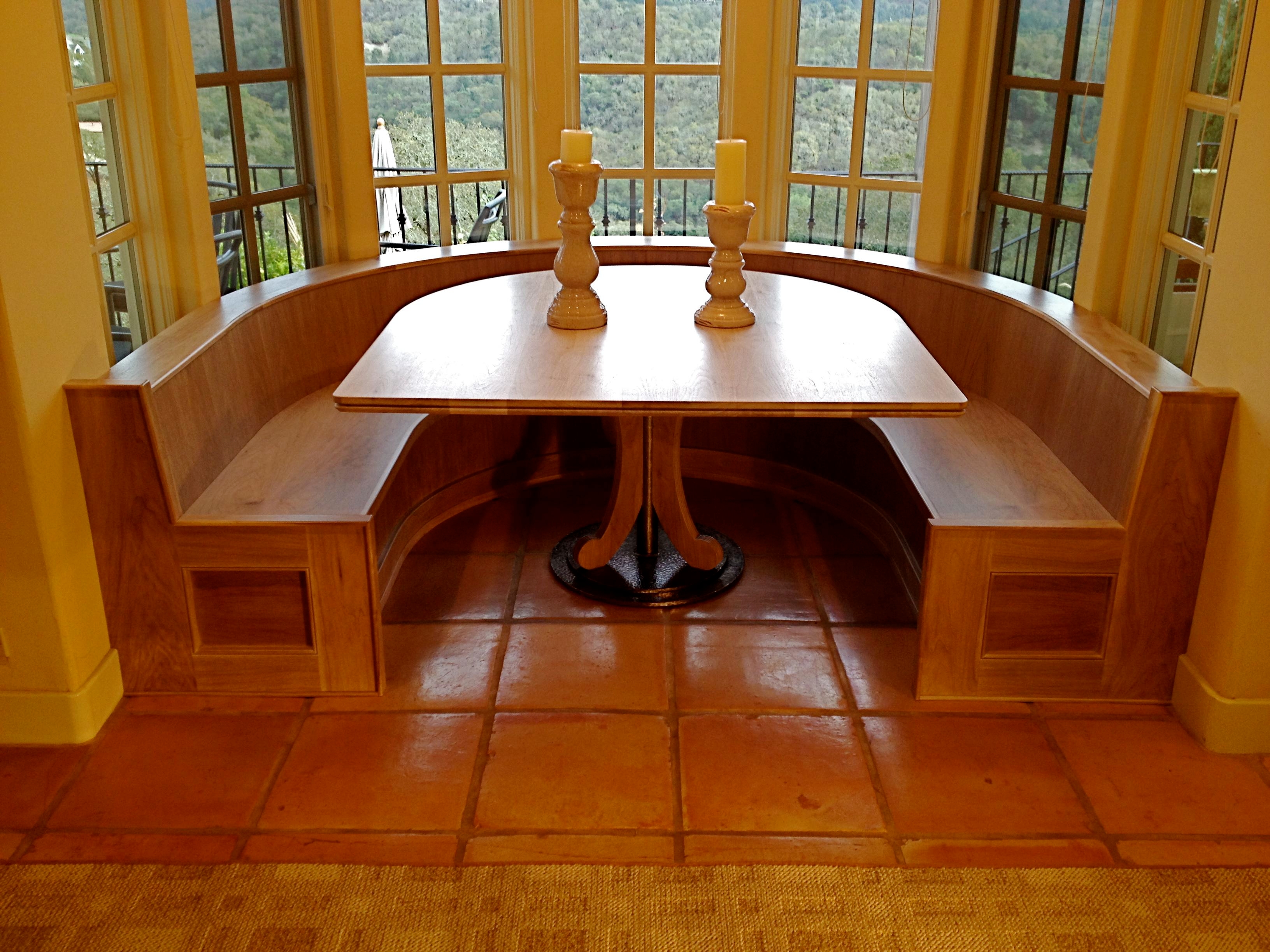 Custom built in banquette and table of bleached Walnut, designed and handcrafted by Philip Snyder of PS Woodworking elegantly utilizes maximum space, storage and comfort in this nook while adding an artistic showpiece to your home or business.