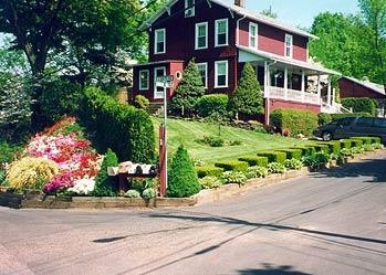 TJB-INC added texture, color, and balance to this 1910 Farmhouse in Hamden, CT