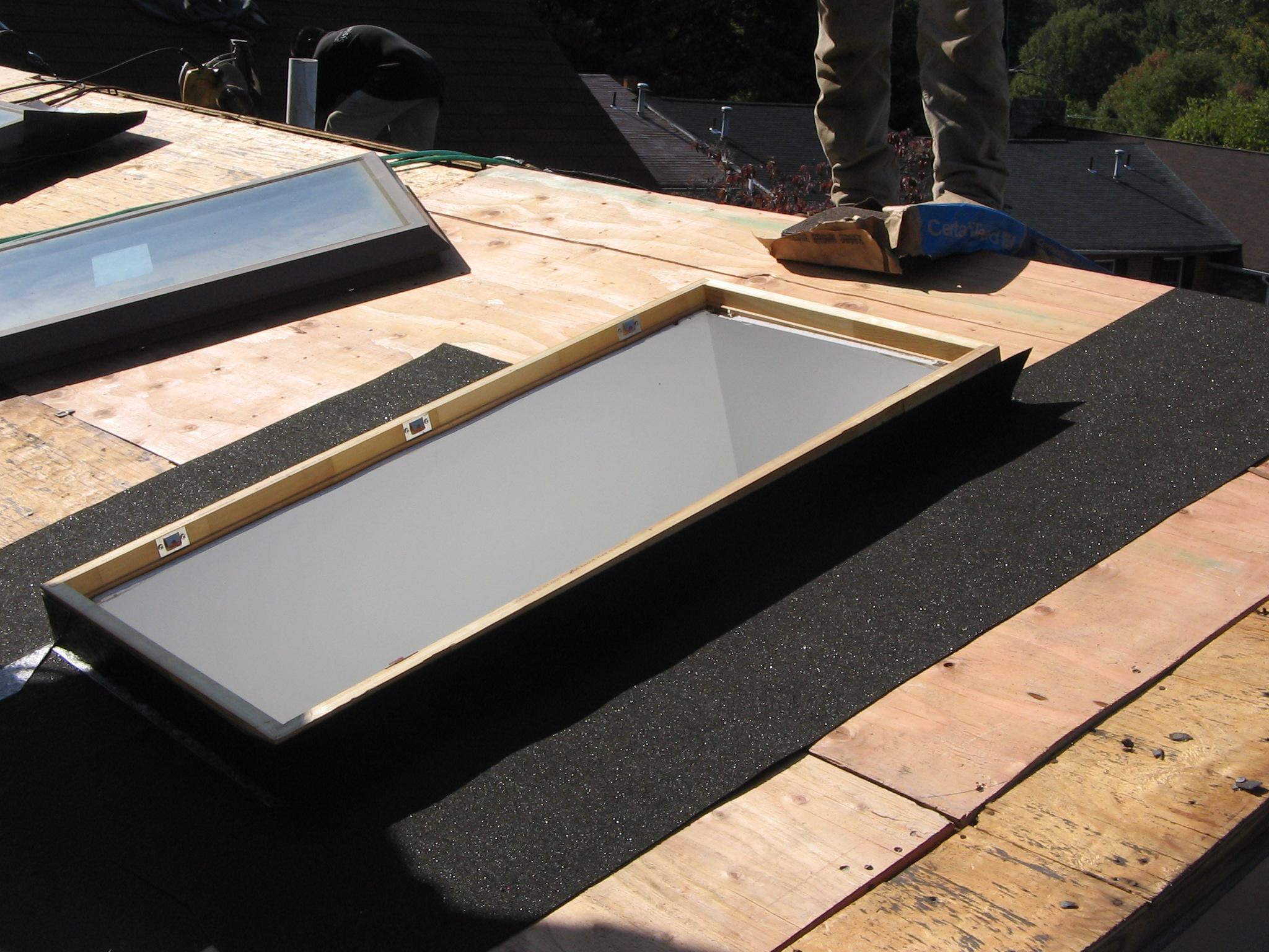 Roofing project, installing plywood and skylights